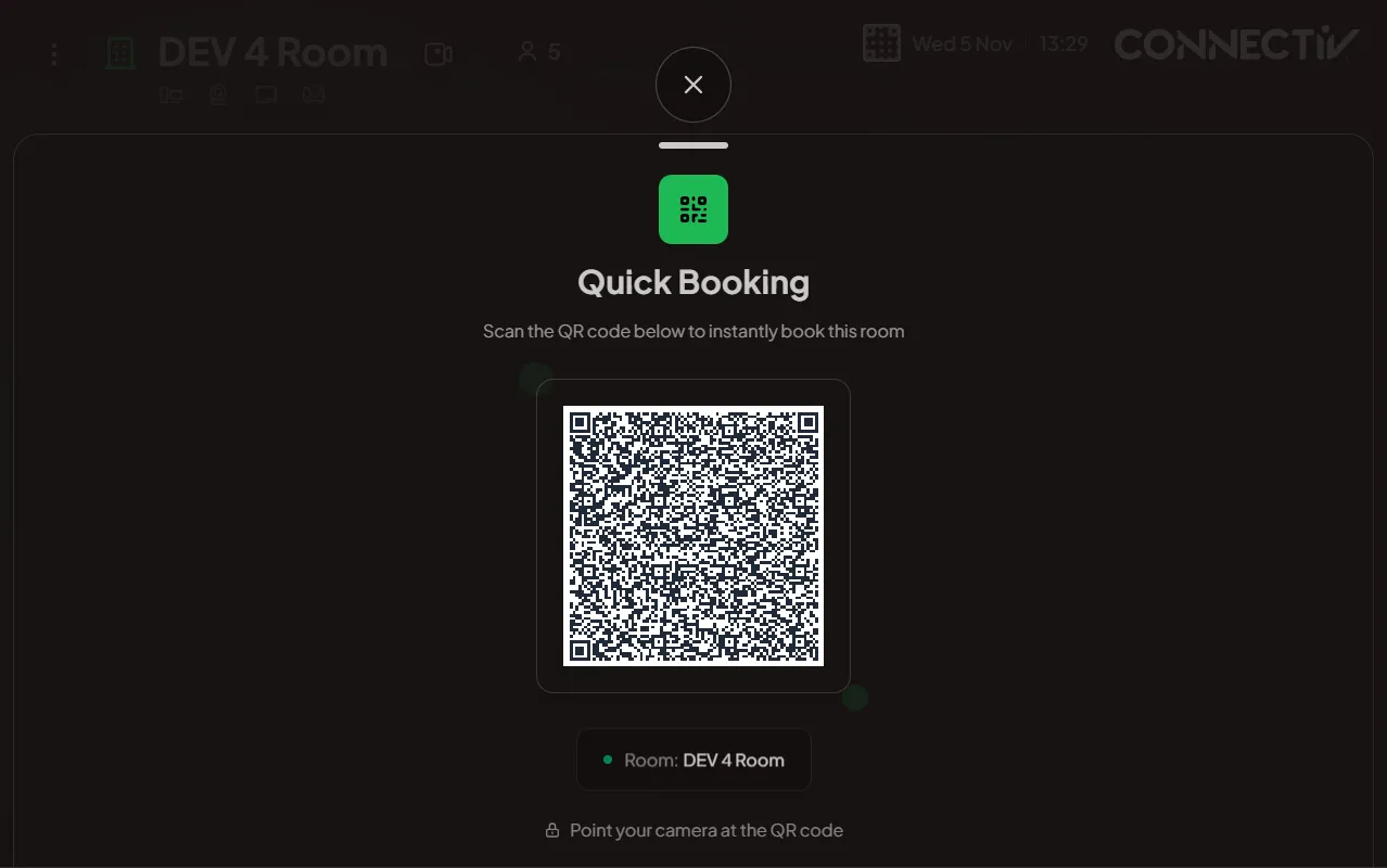 Room display showing a QR code for quick mobile booking